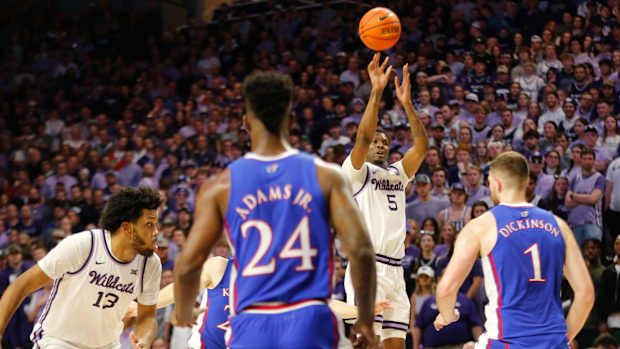 Kansas State freshman guard Chris Carter (5) shoots for three against Kansas in the first half of the Sunflower Showdown inside Bramlage Coliseum Monday, February 5, 2024.  